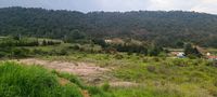 Terreno en venta en Diximoxi, Atlacomulco, con zona despejada y vista a las montañas.